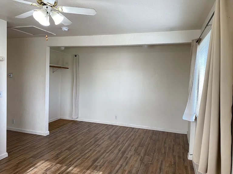 Spacious bedroom with ceiling fan and great ventilation