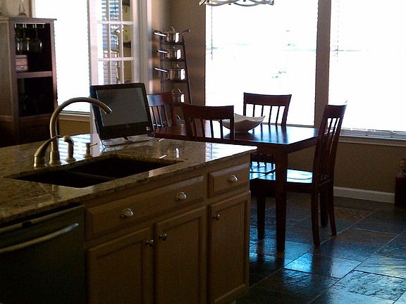 Open kitchen: granite counter tops, slate flooring
