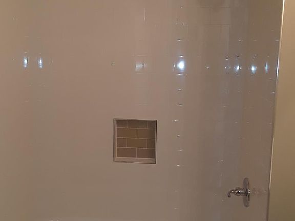 bath with new tub and tile