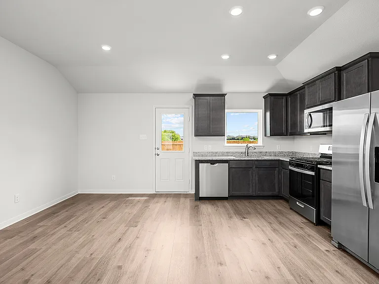 The windows near the kitchen and dining area allow great natural light and backyard views.
