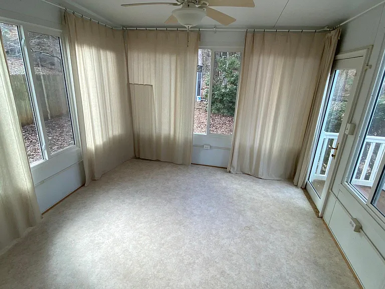 Sunroom with wooded views.