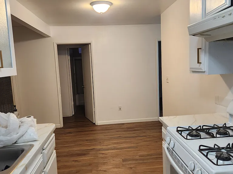 Point of view from the kitchen looking towards a bedroom.