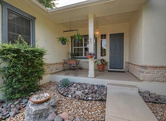 A deep Front Sitting Porch is a perfect place for potted plants or a favorite bench.