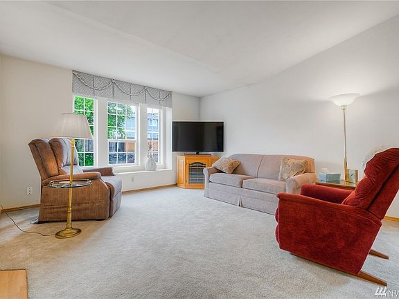 Spacious, light & bright living room with vaulted ceilings.