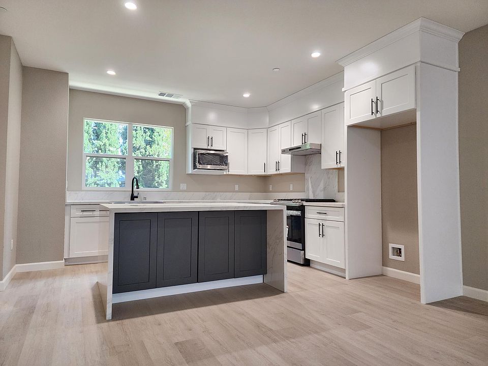 Kitchen with Large Waterfall Island