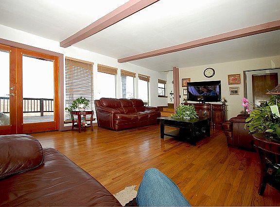 Beams, hardwoods and windows loaded with views