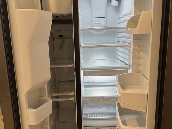 Inside freezer and refrigerator. GE.