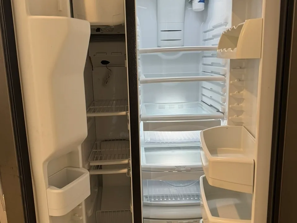 Inside freezer and refrigerator. GE.