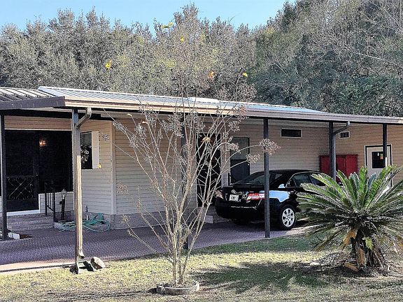 Front of Home w/ Attached Carport