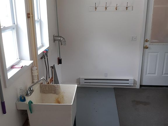Utility room; washer and electric dryer area also shown.