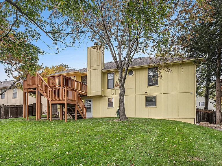 Relax or play in the spacious backyard, where lush grass and open space create the perfect setting for gatherings, outdoor activities, or quiet moments.