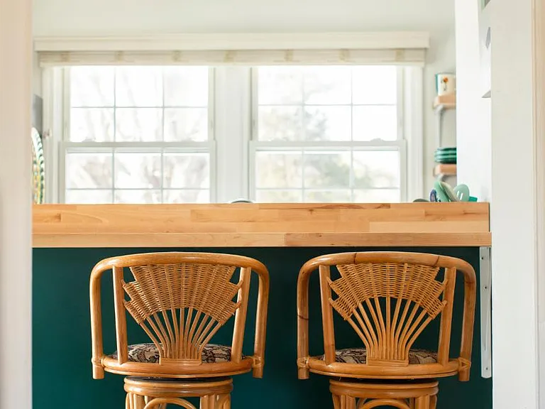 View into kitchen from living room. Bar height counter offers alternate seating or work space.