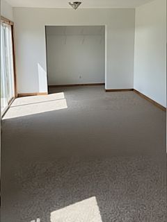 Main floor bonus living space (street facing) with sliding door leading outside.