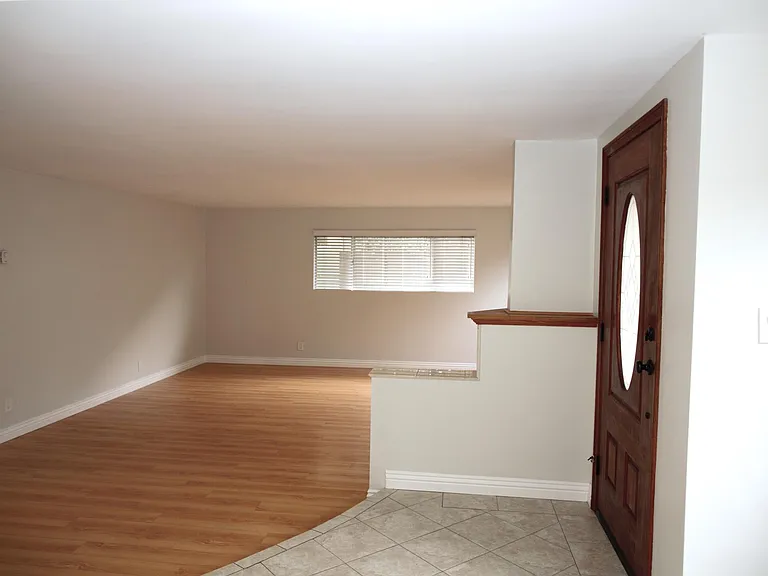 Entry door and partial view of living room