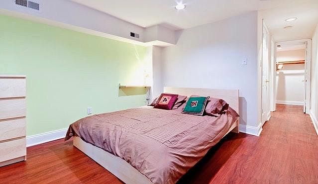 Bedroom with the adjacent large walk-in closet.
