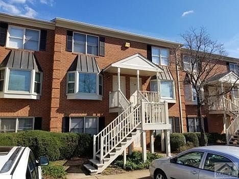 Unit 30 is located at the top right door of this building. Plenty of parking in front with lawn/pool area to the back.