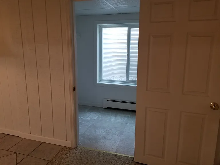 Downstairs walk in closet with Window Egress