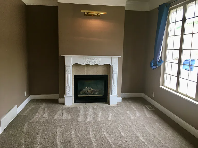 Second photo of parlor with new carpet.