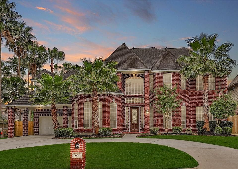 Talk about CURB APPEAL! A circular driveway, porte-cochere, and lush landscaping welcome you home.