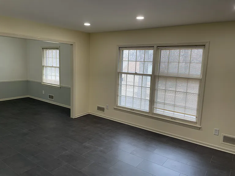 New luxury vinyl flooring seamless flowing from living to dinning room.