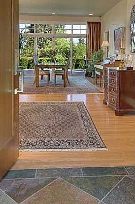 Slate and hardwood entry leads to the dining area.