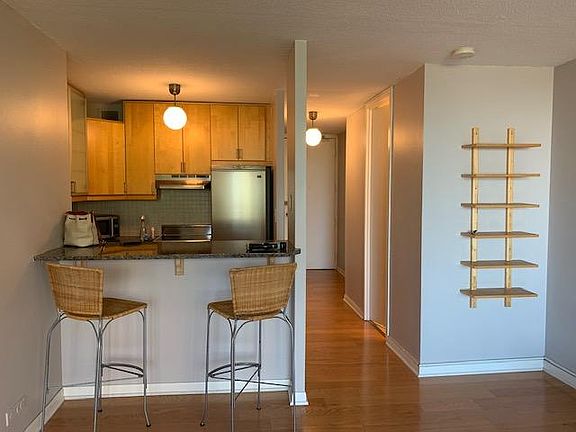 Kitchen with breakfast bar (view from the spacious living room)