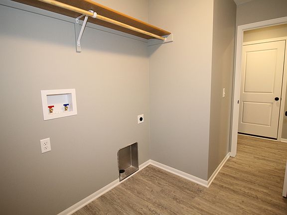 Image shows upgraded flooring and painted trim.