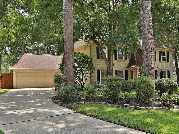 Driveway with long setback provides plenty of room for parking. Full two car garage includes a full stall for storage.