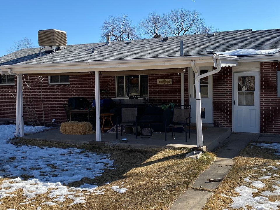 Shows rear patio with patio door entry to landing adjoining upstairs kitchen; stairs at landing go down to apartment landing/entry.