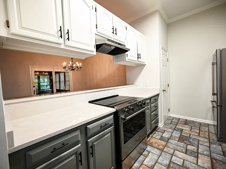 Updated kitchen with pantry opens to the bar.