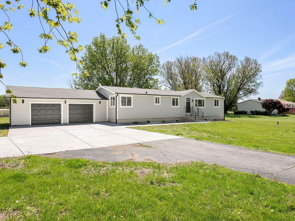 Front of the house with attached two car garage