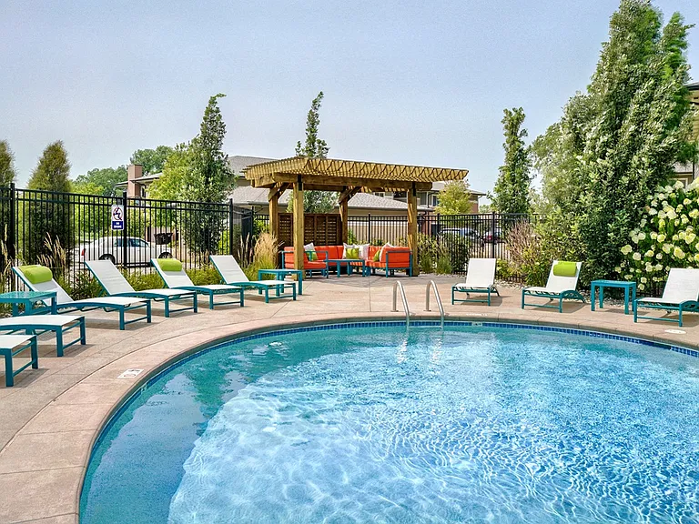 Relax poolside on comfortable lounge chairs, the perfect spot to enjoy sunny days.