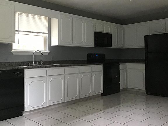 Updated kitchen arrangement, with space for dining set out of picture.