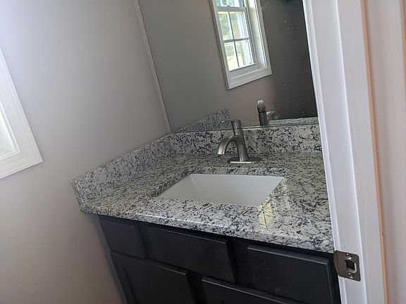 Downstairs half bath. Enter through kitchen.