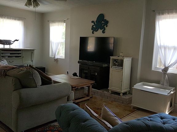 Lots of living room space for winding down in front of the fireplace.