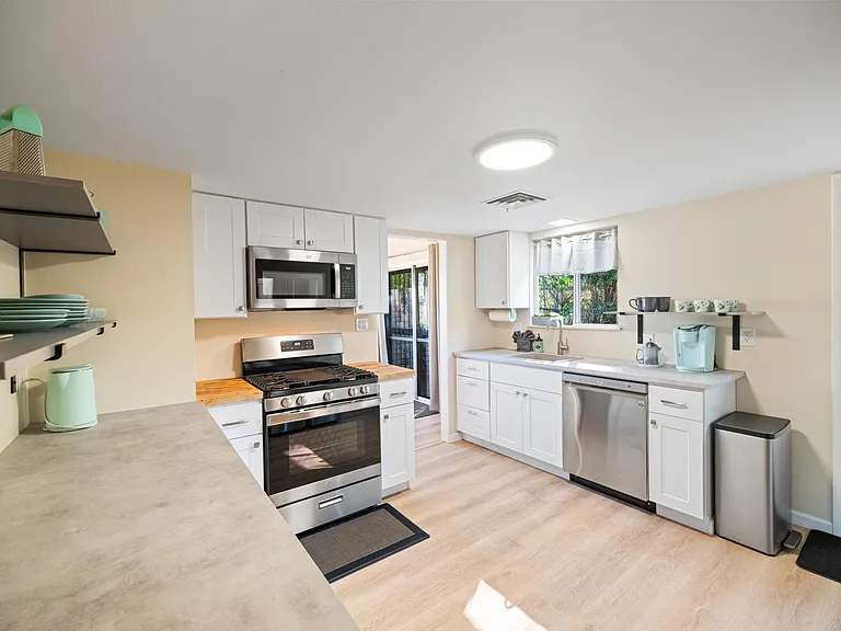 Lovely NEW kitchen fully updated With GAS range, Dishwasher, Microwave, Refrigerator and Garbage Disposal