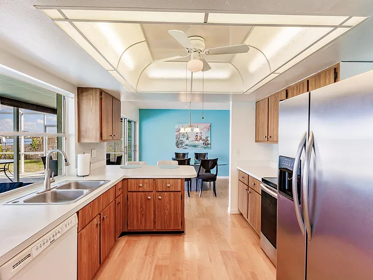 Kitchen from 
TV room to dining and patio
