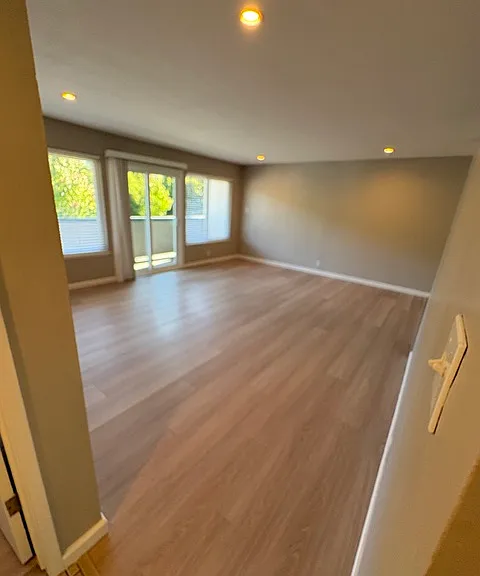 Living Room: Freshly painted,4" recessed Can Lights with/ 3wy switch,New Oak Laminate Flooring, 2" Faux Blinds