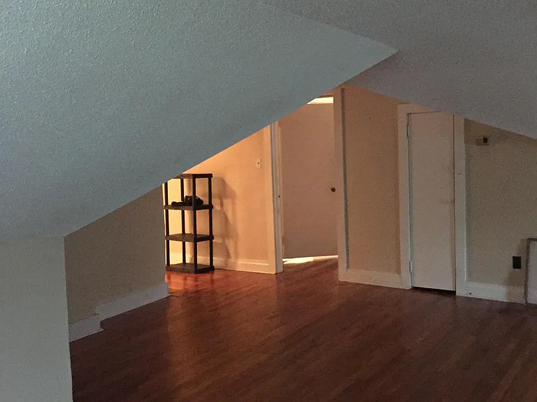Great Room entry area with bedroom door in center and cedar closet to right