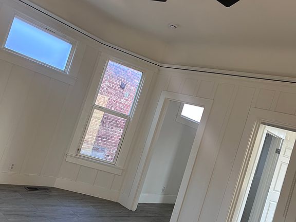 Another photo of living room and entrance.