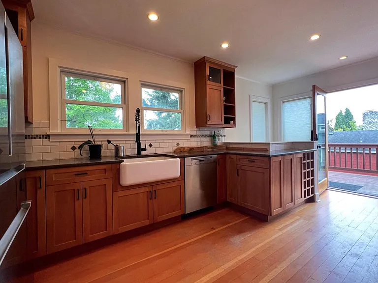 large open kitchen and back door to spacious deck