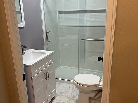 Walk in full size shower with glass shower doors!