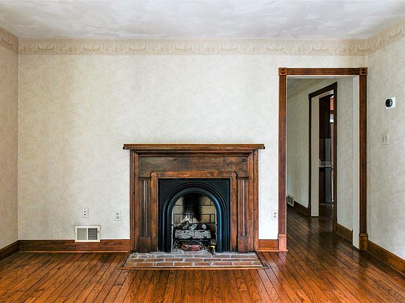 Living Room. The decorative fireplace adds to the home's charm.
