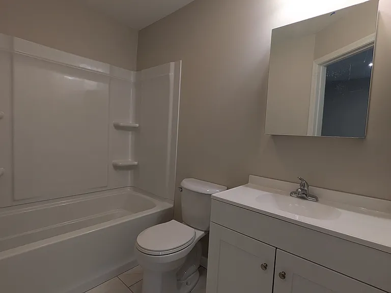 Roomy bathroom with a tub/shower right off the kitchen