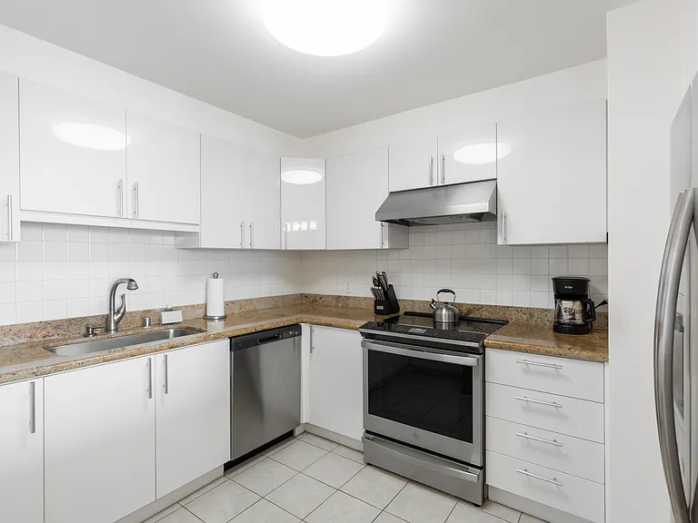 Fully stocked kitchen with stainless steel appliances