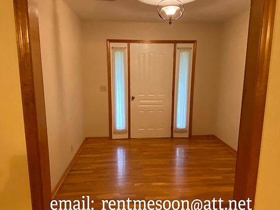 The view from the den back to the foyer and front door.