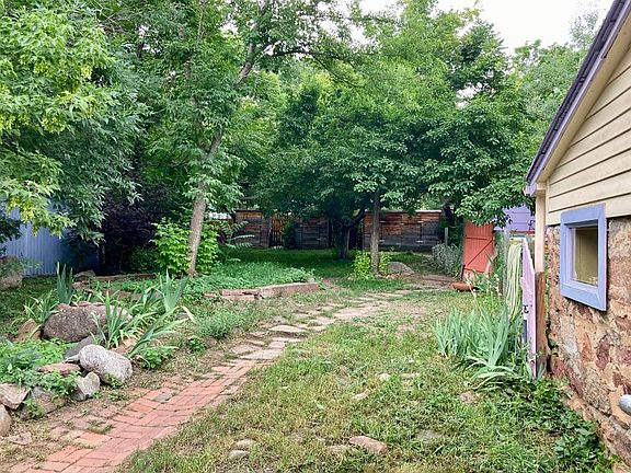 Shady, fenced backyard.