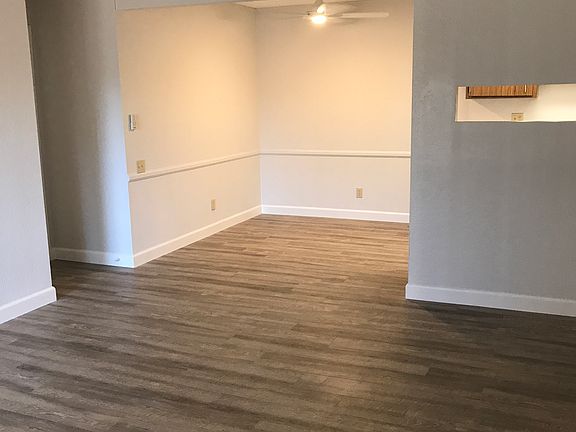 living room & dining room with wood laminate flooring