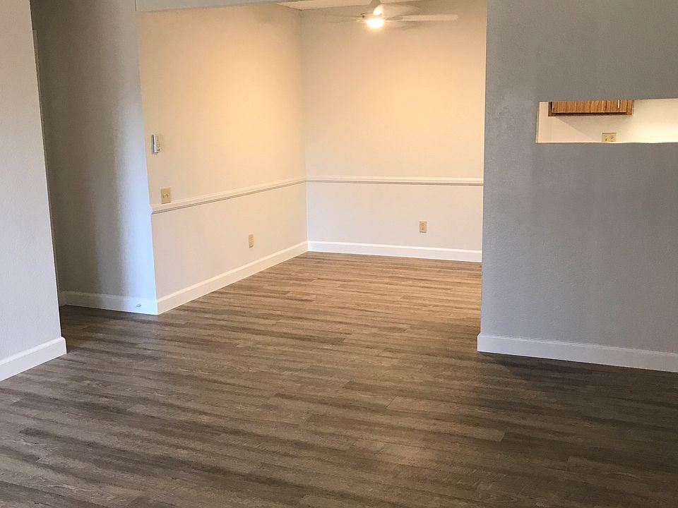 living room & dining room with wood laminate flooring