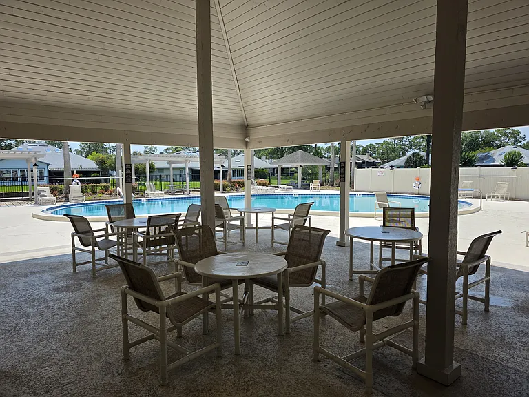 Covered seating area on pool deck